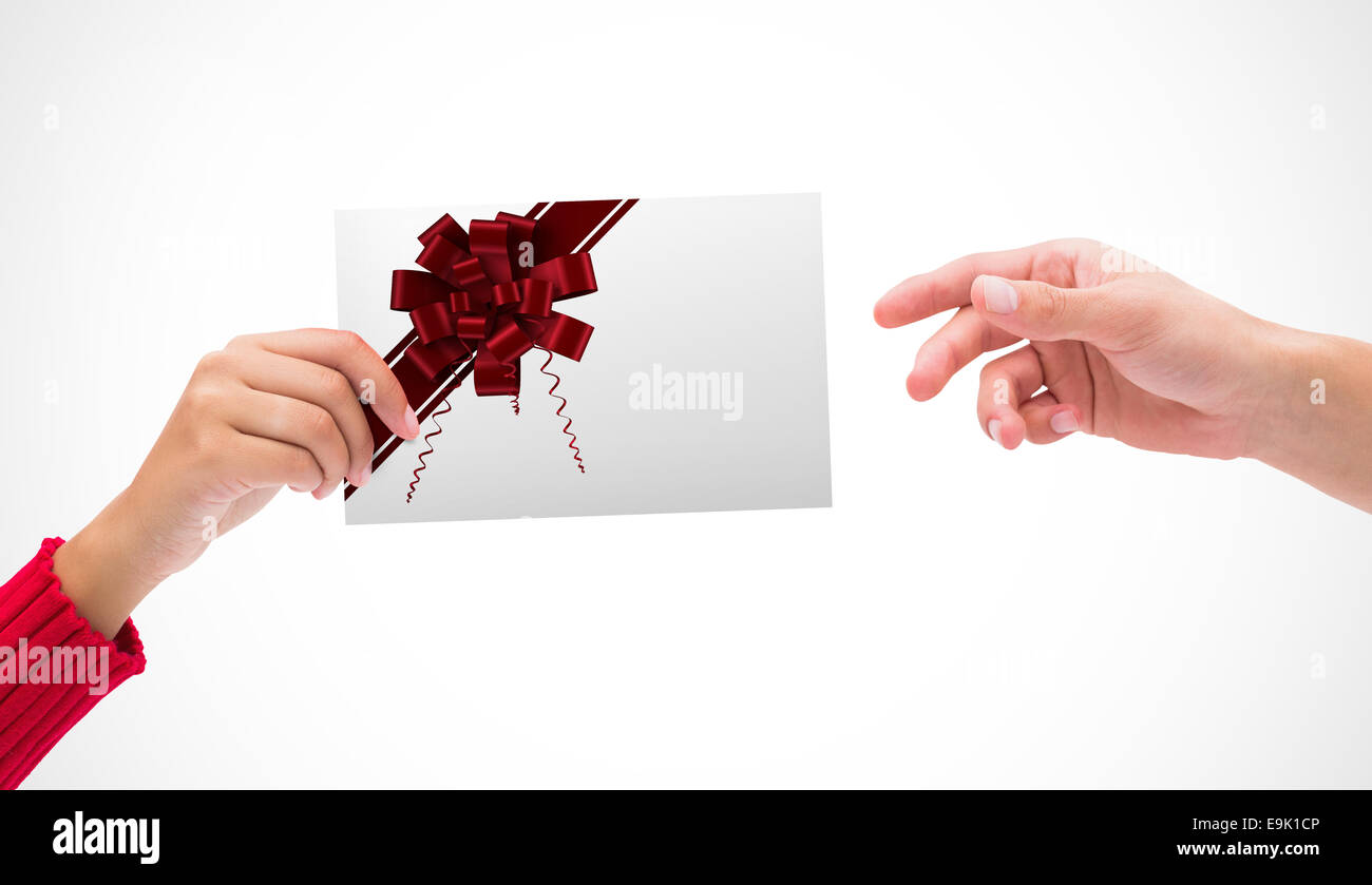 Composite image of hands holding card Stock Photo - Alamy