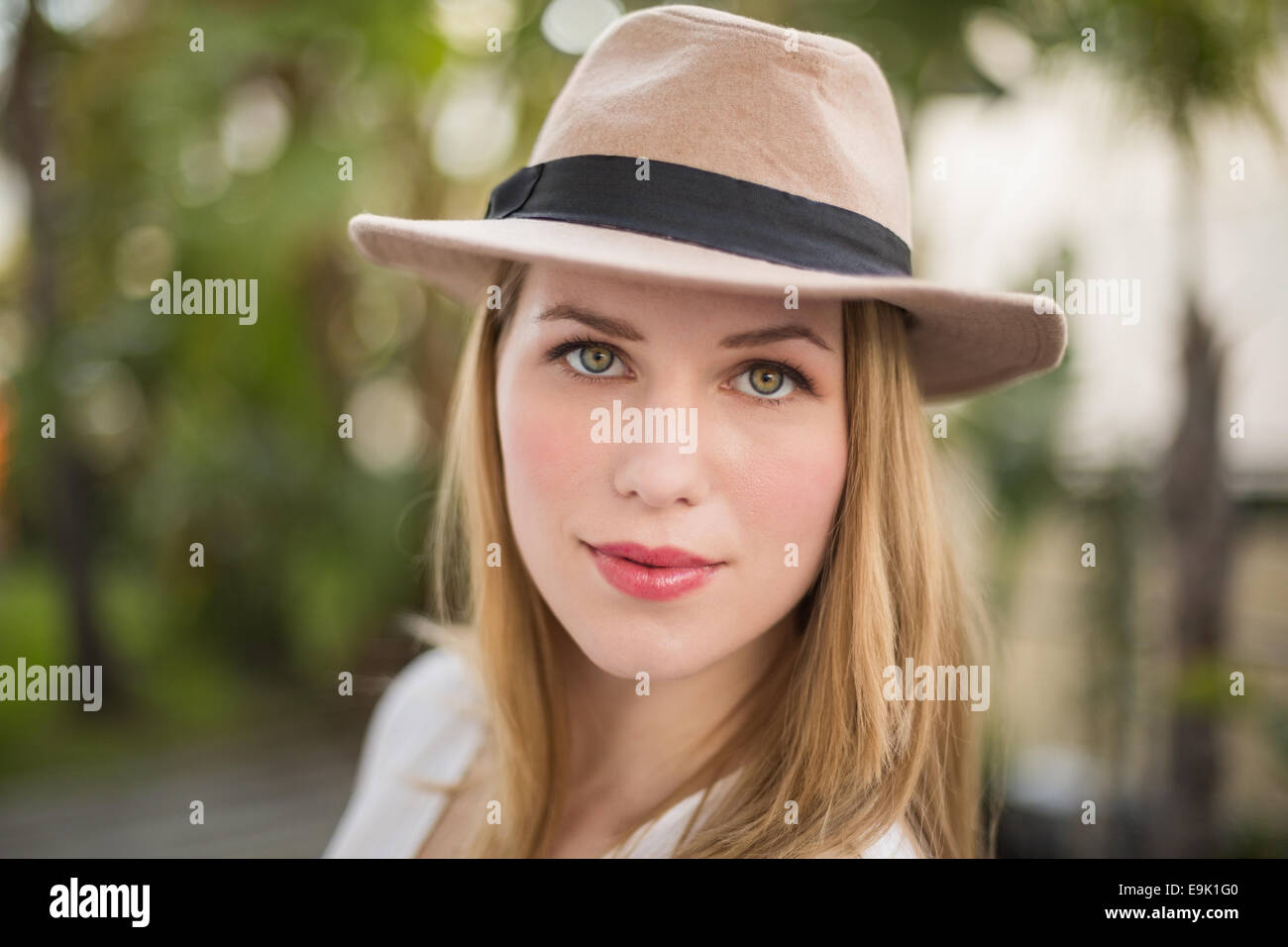 Close up of a blonde woman wearing hat Stock Photo - Alamy