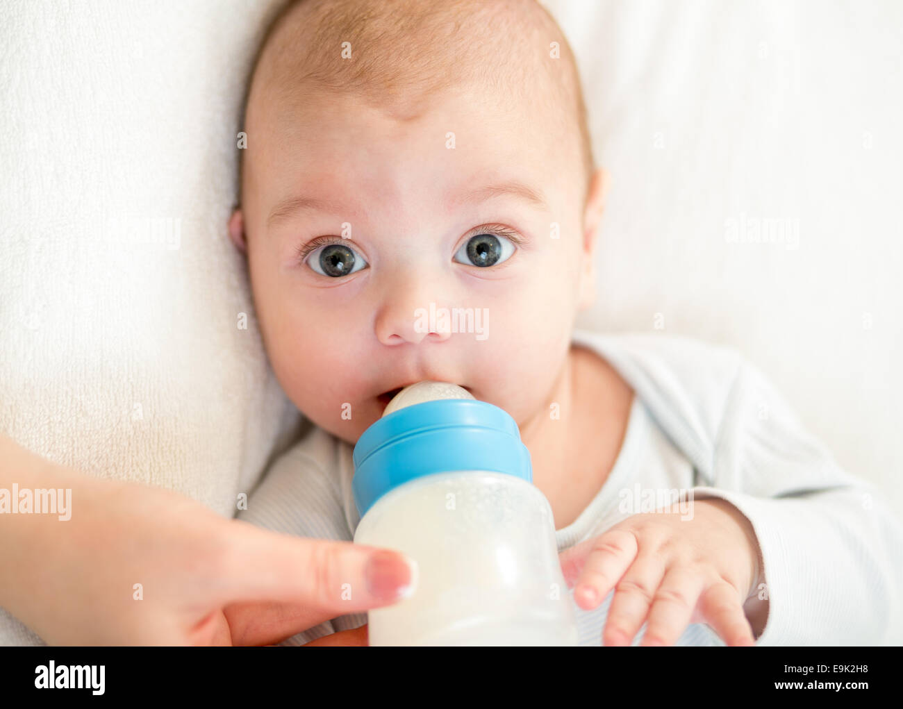 https://c8.alamy.com/comp/E9K2H8/baby-boy-eating-from-milk-bottle-E9K2H8.jpg