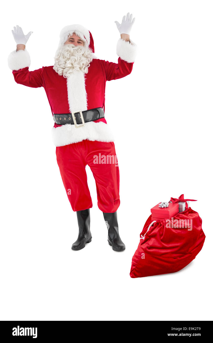 Happy santa claus with sack full of gifts Stock Photo