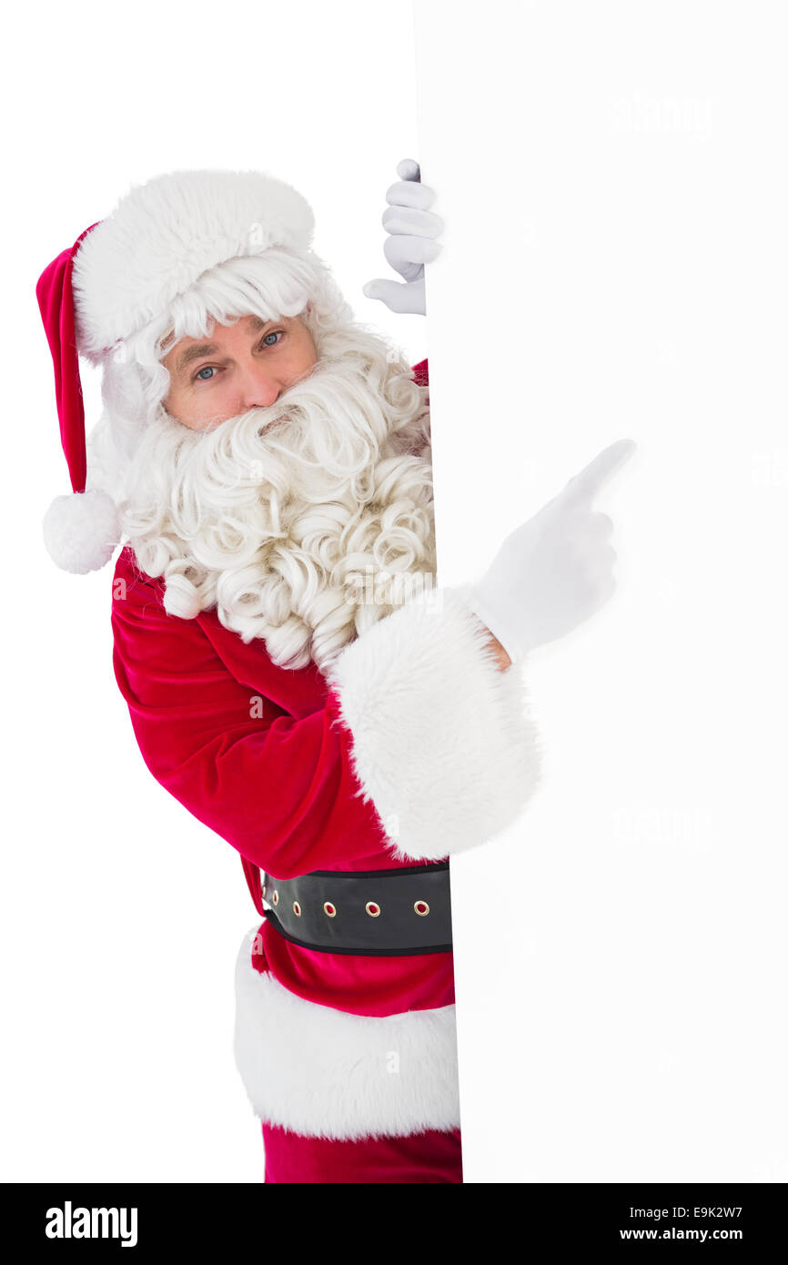 Smiling santa claus pointing poster Stock Photo - Alamy
