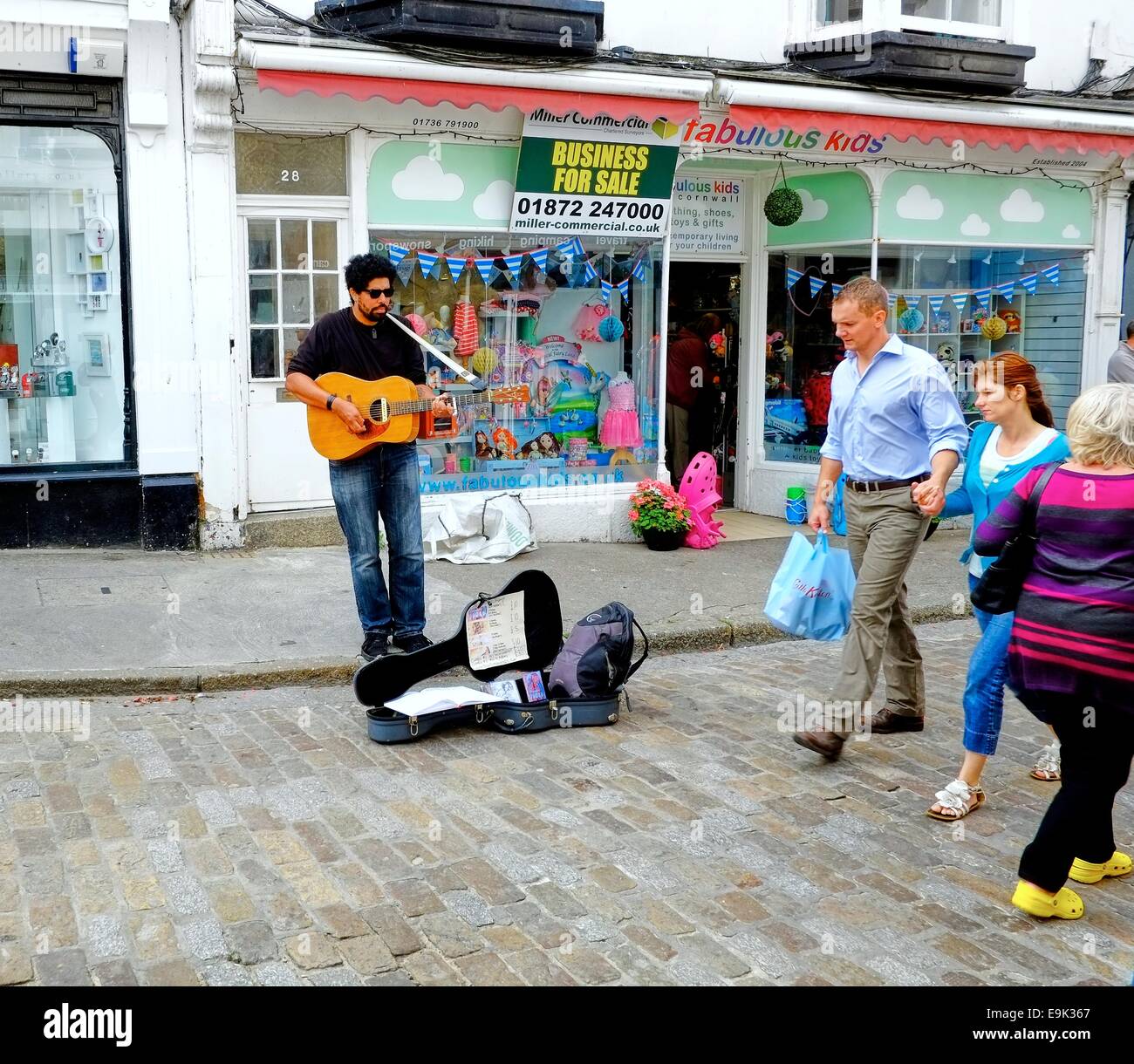 A busker performing in St ives Cornwall england uk Stock Photo