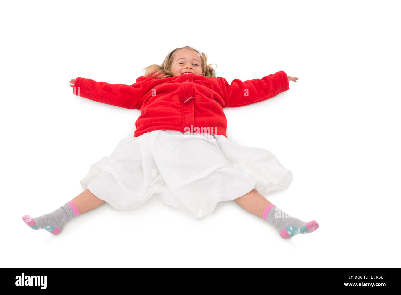 Cute little girl lying on floor Stock Photo - Alamy
