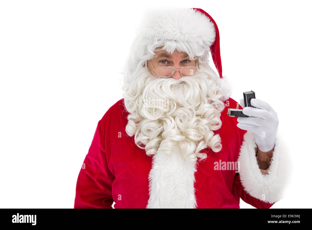 Santa claus holding engagement ring hires stock photography and images