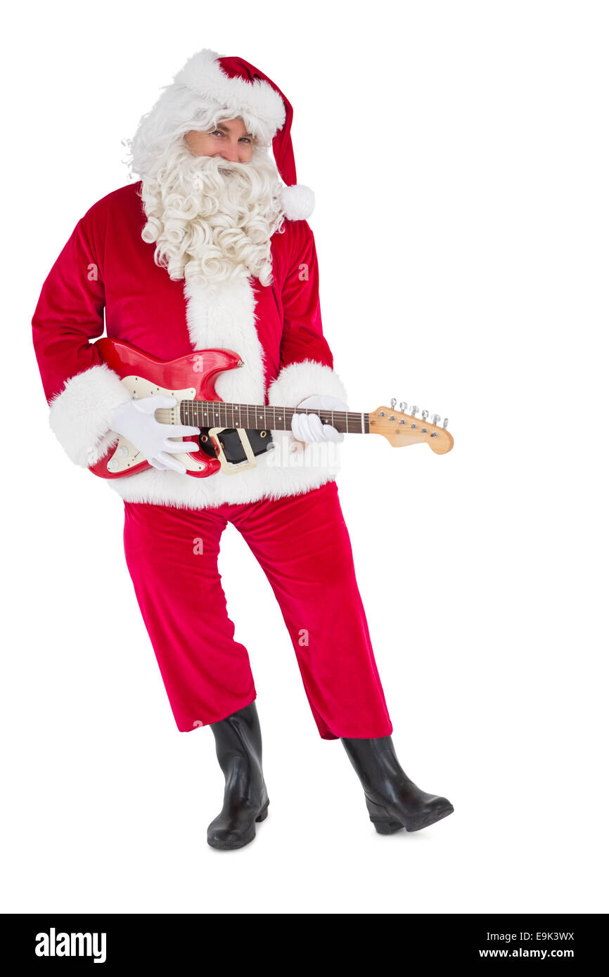 Happy santa playing electric guitar Stock Photo
