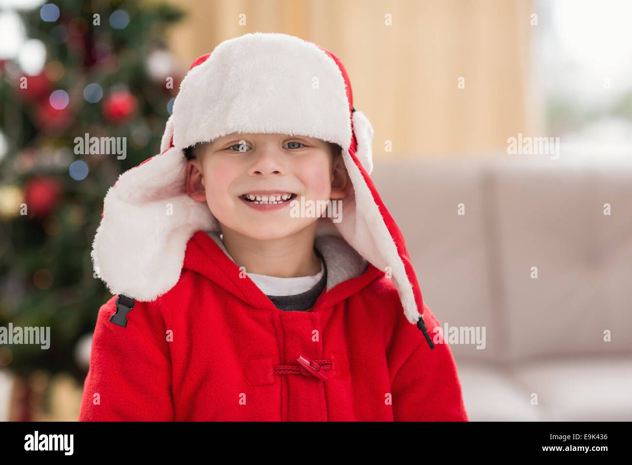Festive little boy smiling at camera Stock Photo - Alamy