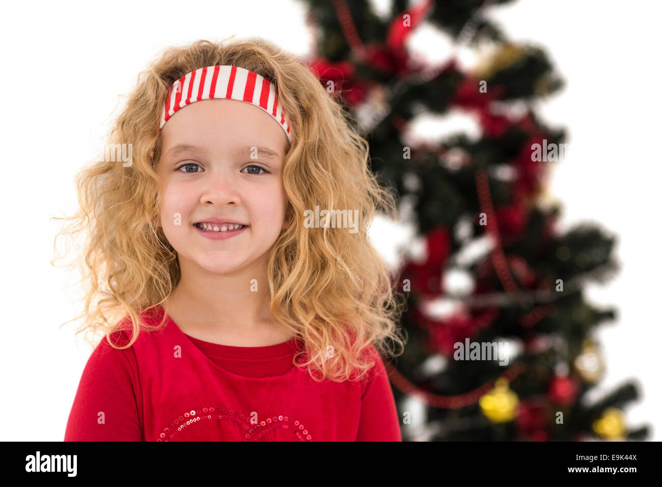 Festive little girl smiling at camera Stock Photo - Alamy