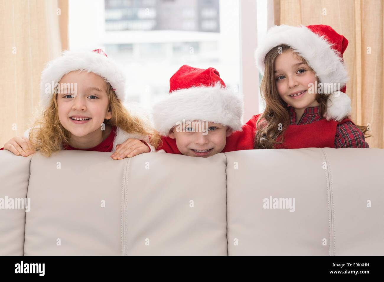 Festive little siblings smiling at camera Stock Photo - Alamy