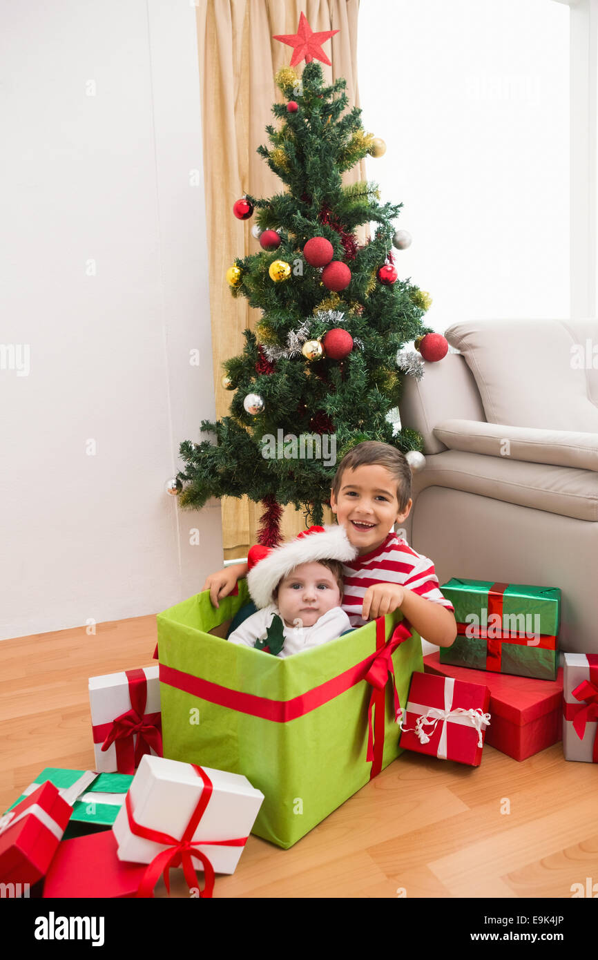 Cute boy and baby brother at christmas Stock Photo