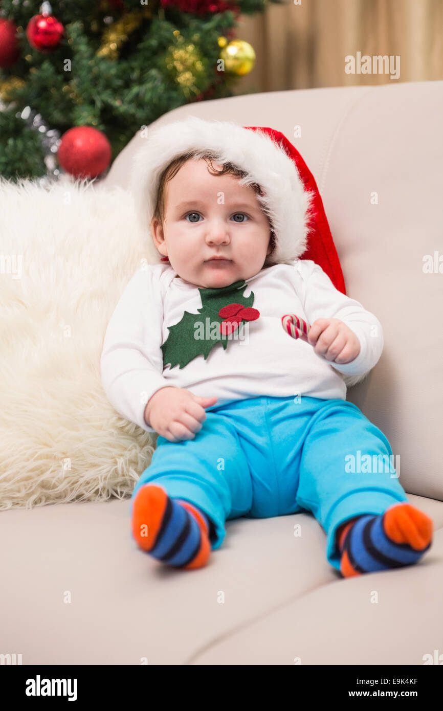 Cute baby boy on couch at christmas Stock Photo Alamy