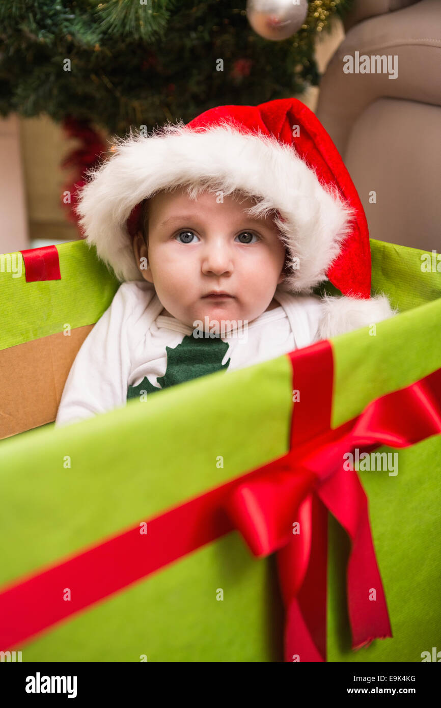Cute baby boy in large christmas present Stock Photo - Alamy