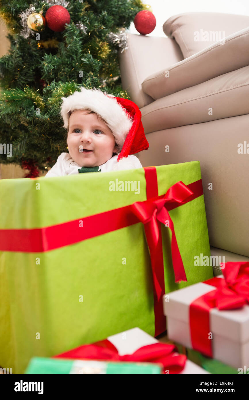 Cute baby boy in large christmas present Stock Photo - Alamy