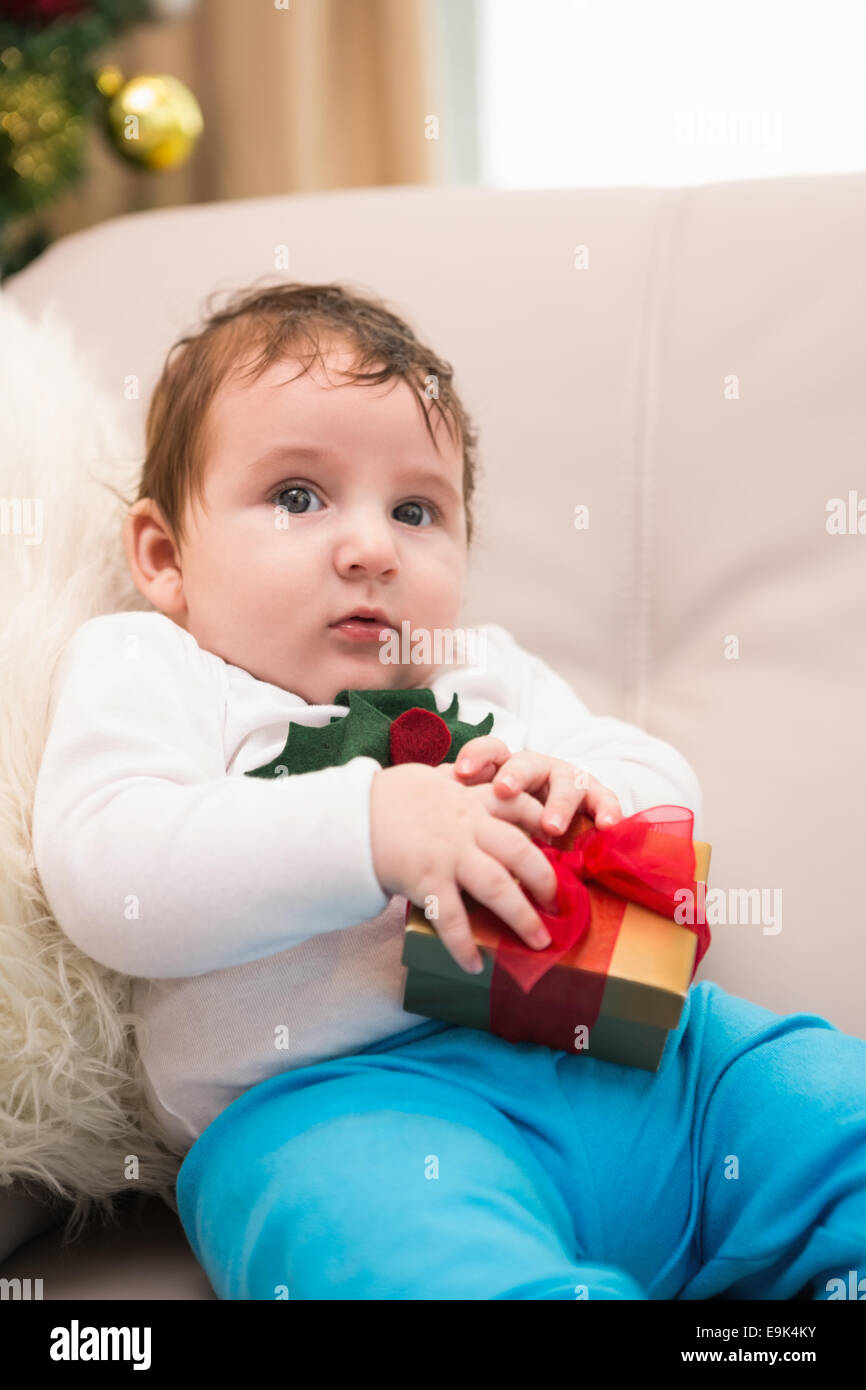 Cute baby boy on the couch at christmas Stock Photo