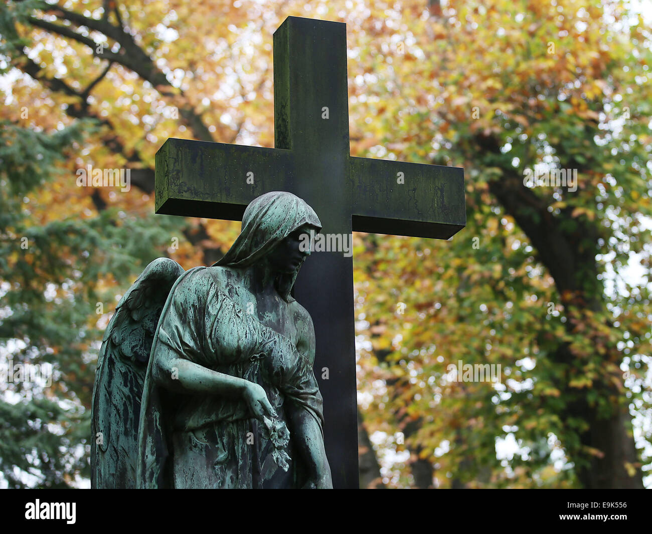 Cologne, Germany. 29th Oct, 2014. An autumn leaves behind a headstone in the Melaten cemetery in Cologne, Germany, 29 October 2014. 1 November 2014 is All Saints' Day. Credit:  dpa picture alliance/Alamy Live News Stock Photo