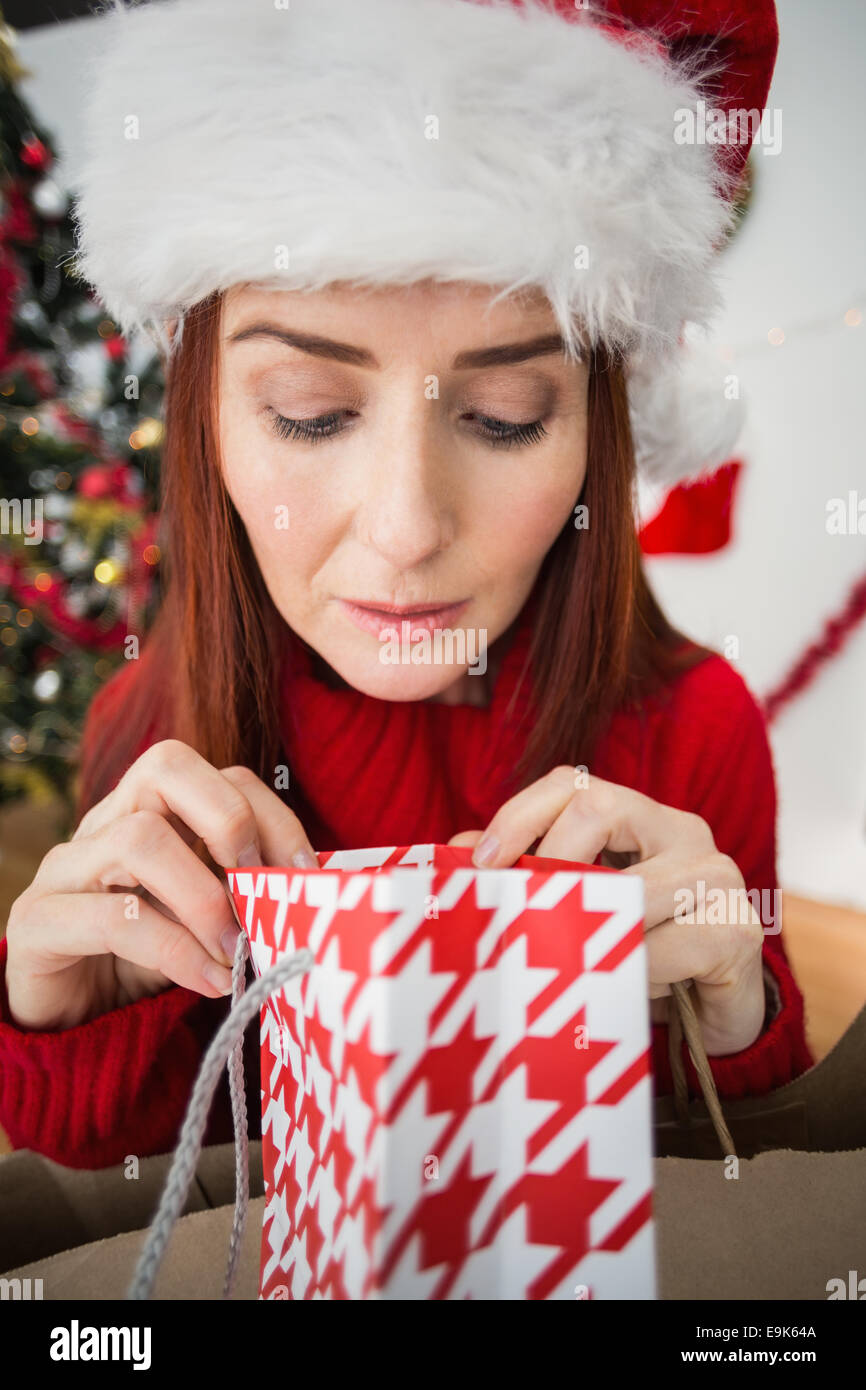 Mature woman christmas gift looking hi-res stock photography and images ...