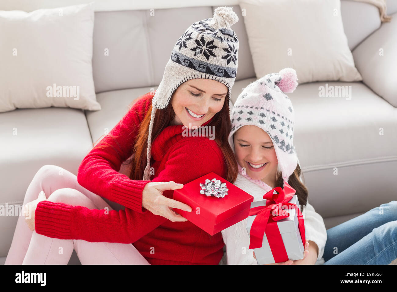 Mother and daughter exchanging gifts at christmas Stock Photo Alamy