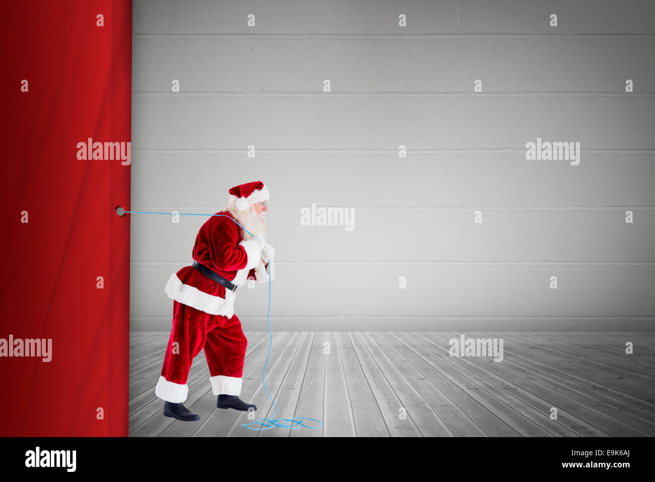 Santa claus pulling a rope Stock Photo Alamy
