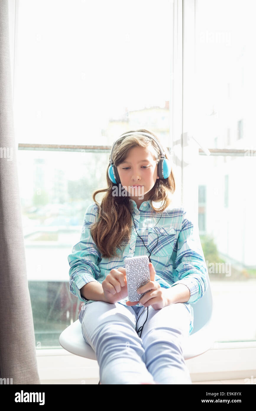 Girl listening to music at home Stock Photo