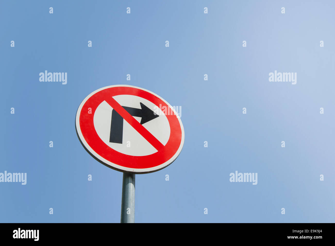 Low angle view of no right turn sign against clear sky Stock Photo