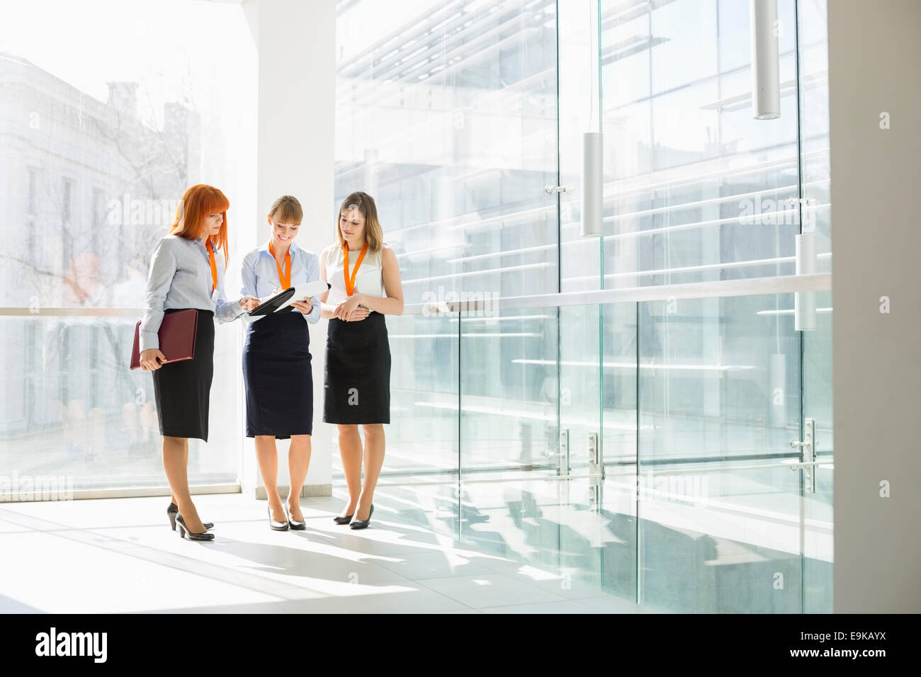 Full-length of businesswomen discussing in office Stock Photo
