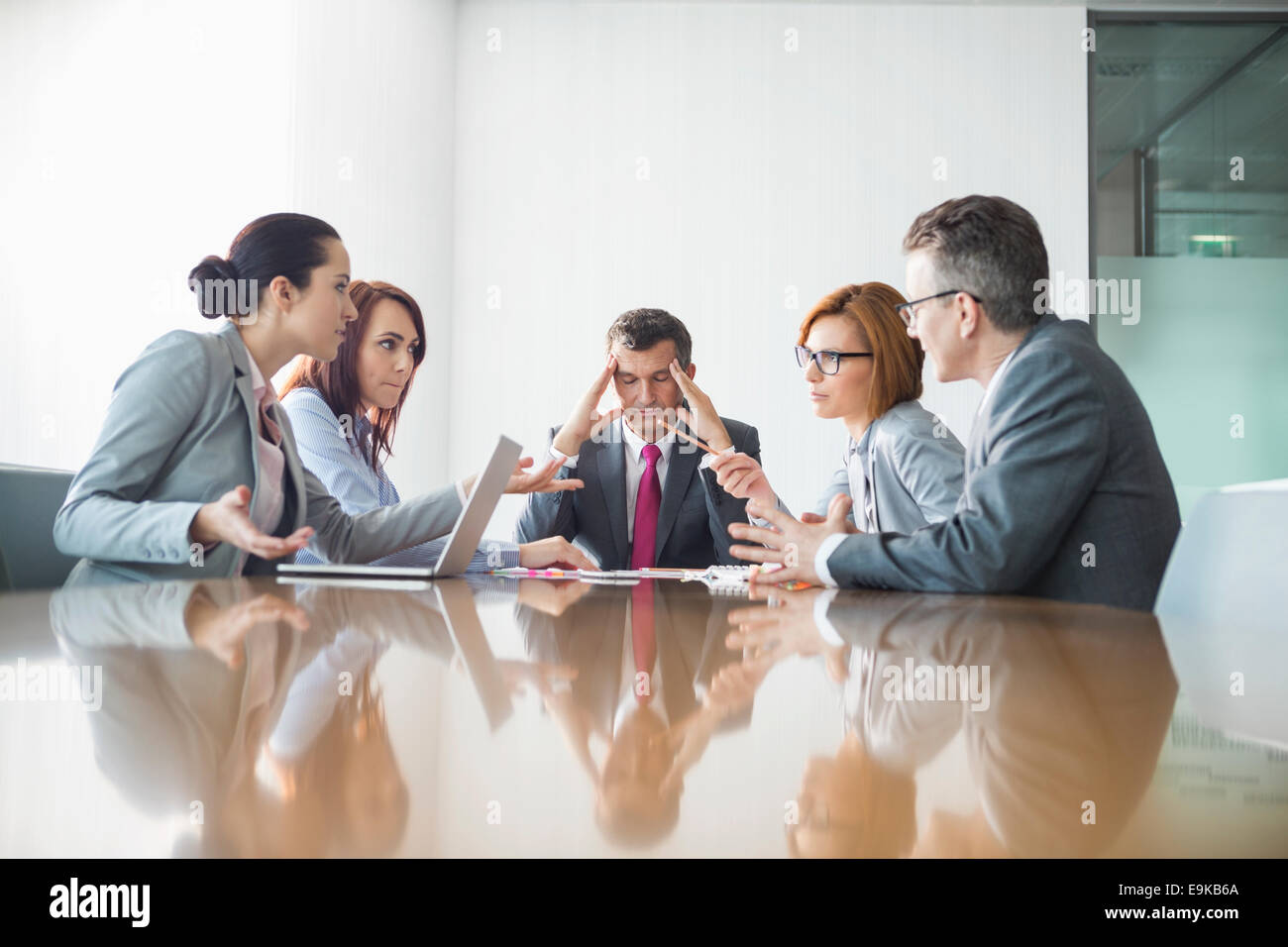Businesspeople arguing in meeting Stock Photo