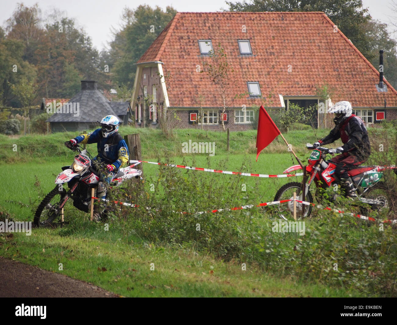 Men riding  cross motorcycles at an enduro event in Ruurlo, the Netherlands. Stock Photo