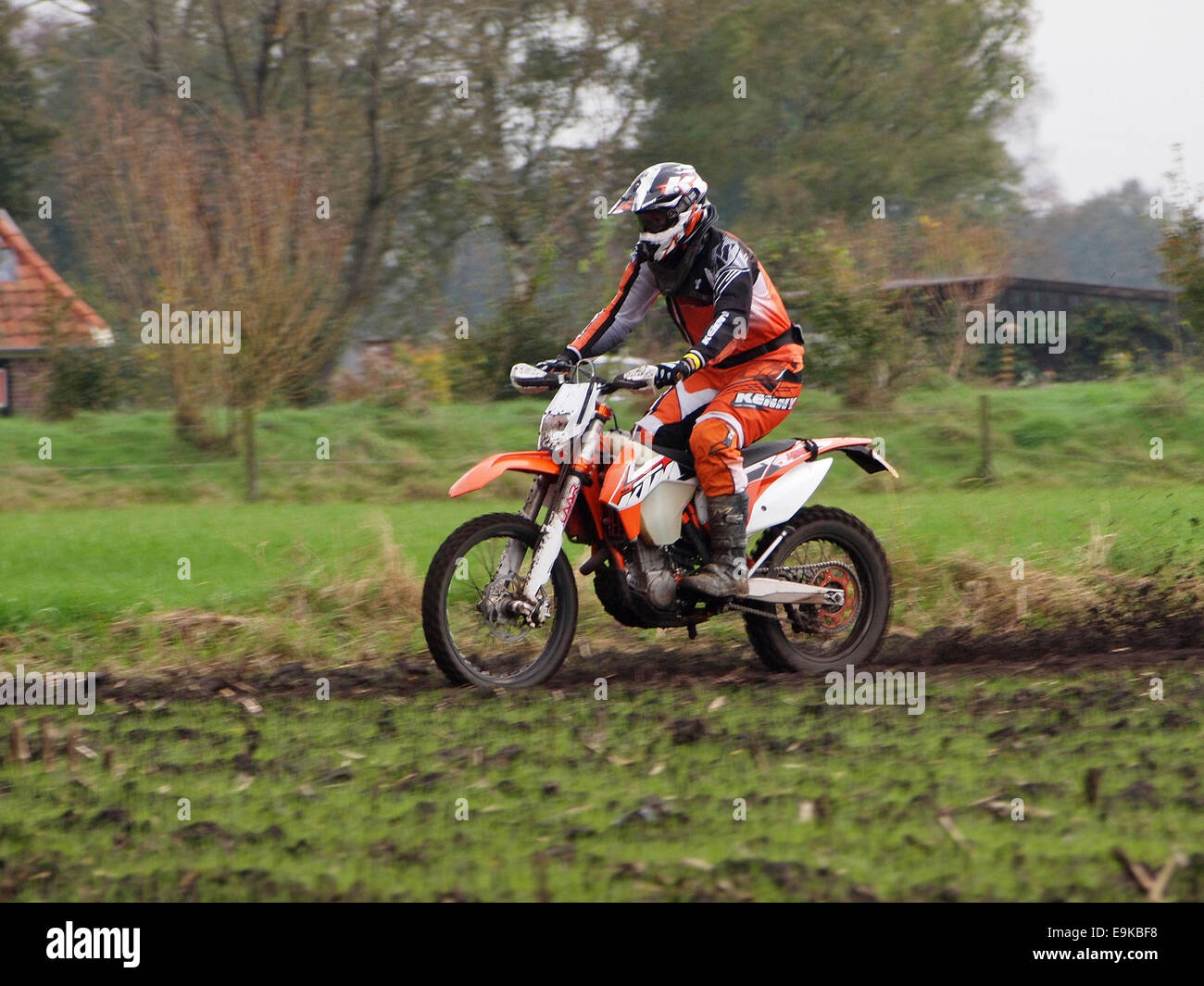 KTM 450cc offroad enduro motorcycle riding through a field in Ruurlo, the Netherlands Stock Photo