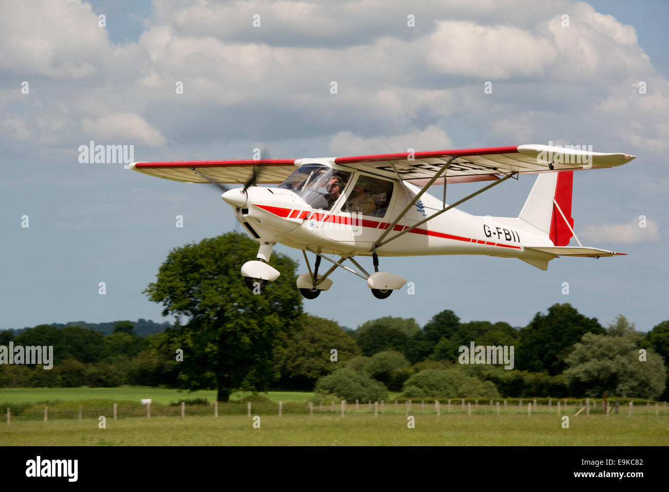Ikarus C42 FB100 G-FBII taking-off from Headcorn Airfield Stock Photo