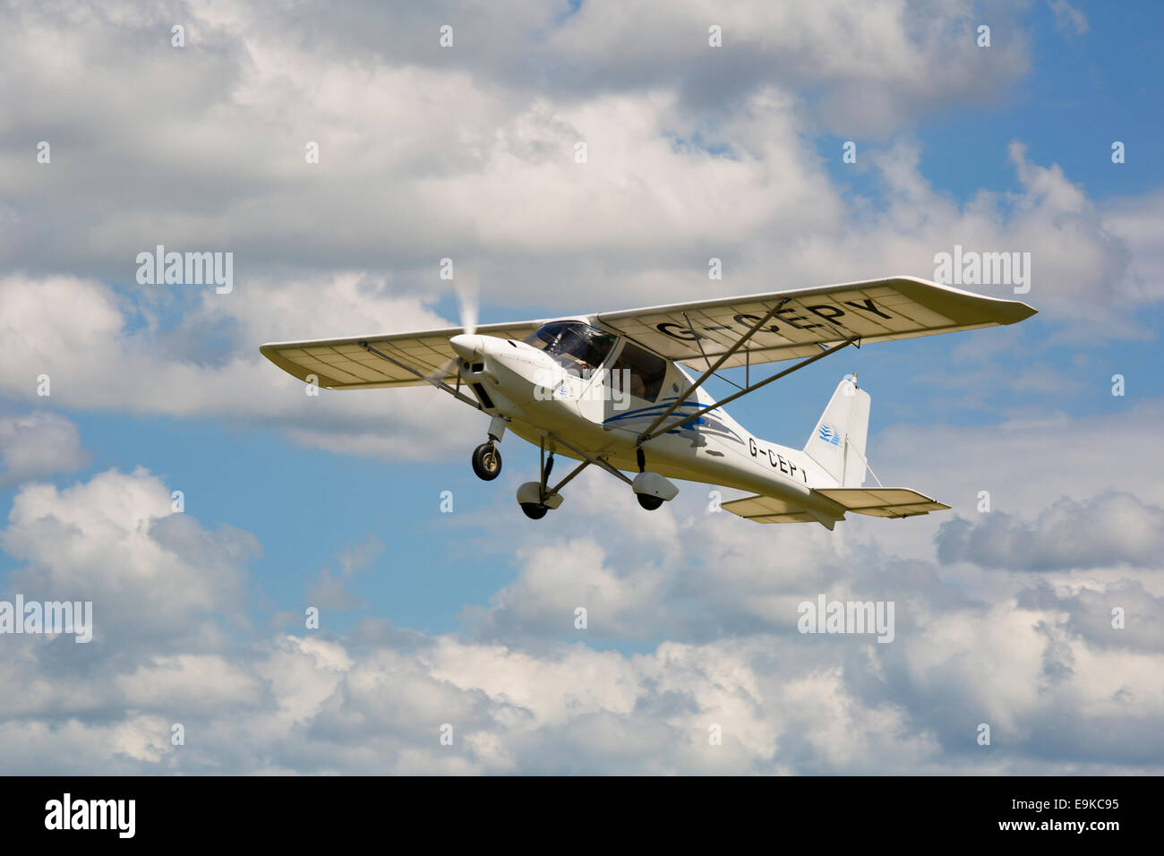 Ikarus C42 FB80 G-CEPY in flight after take-off from Headcorn Airfield Stock Photo