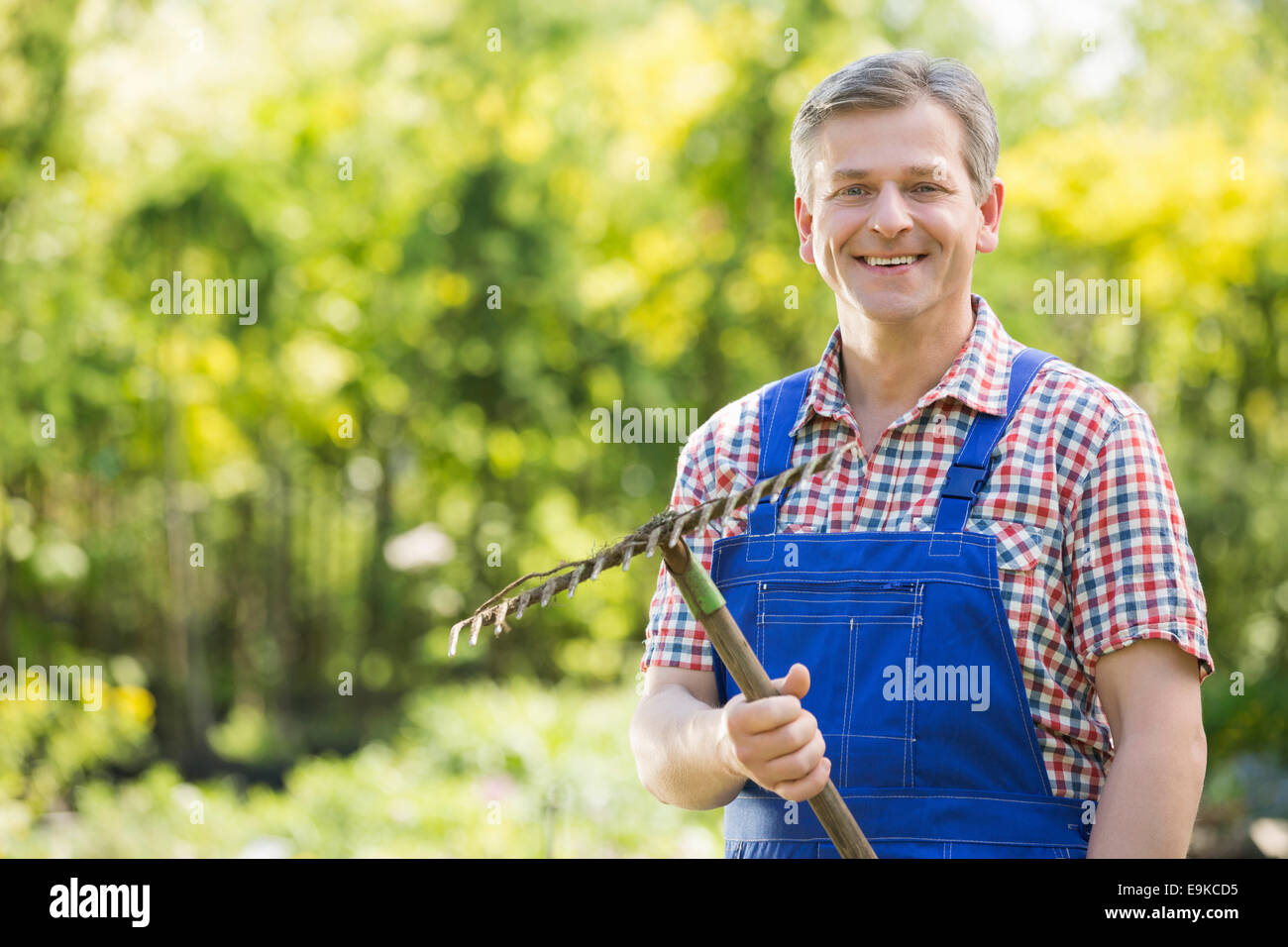 Holding rake hi-res stock photography and images - Alamy