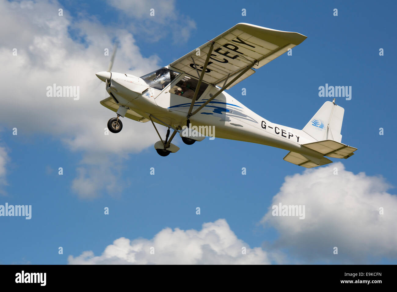 Ikarus C42 FB80 G-CEPY in flight after take-off from Headcorn Airfield Stock Photo
