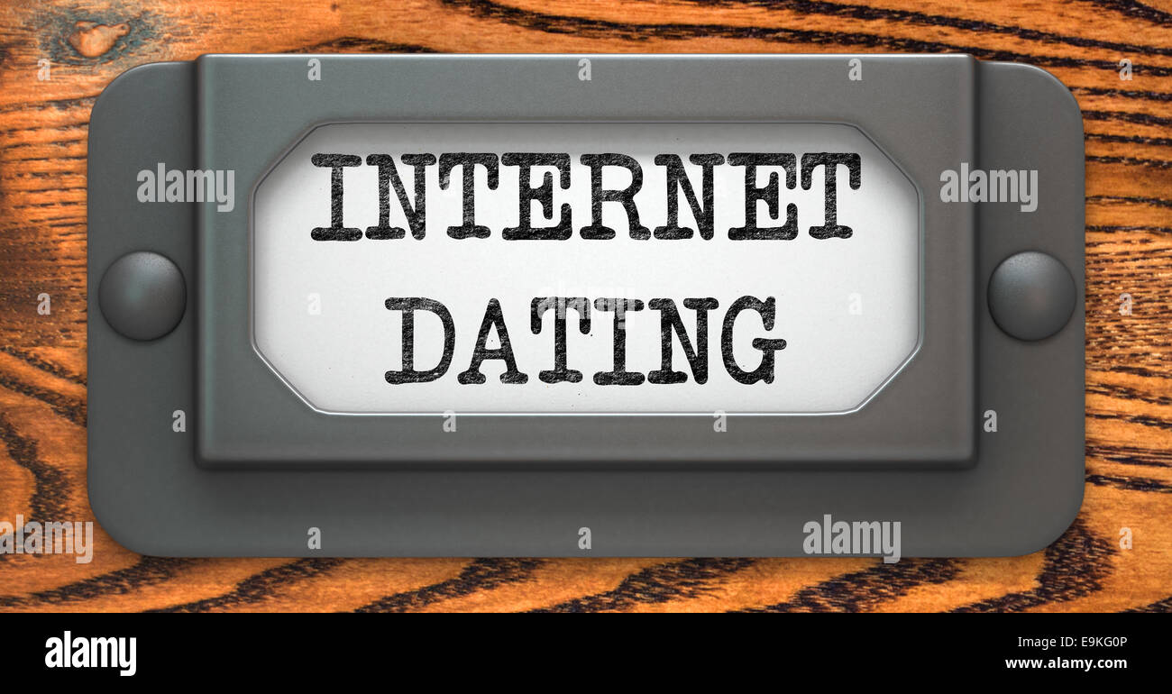 Internet Dating - Inscription on File Drawer Label on a Wooden Background. Stock Photo