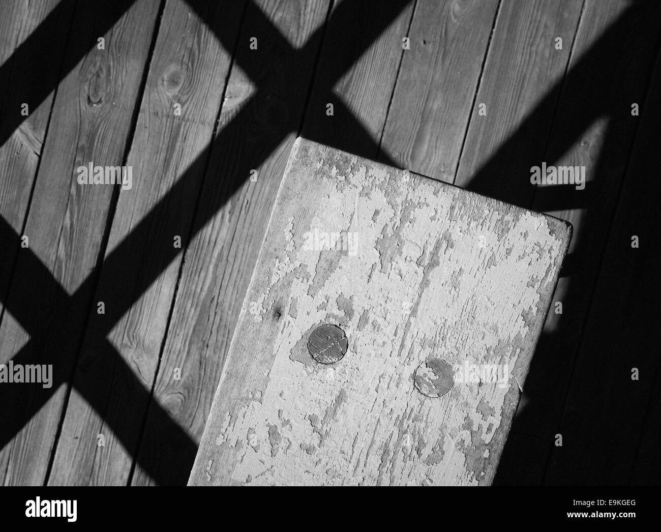 Empty wooden bench and shadow patterns Stock Photo