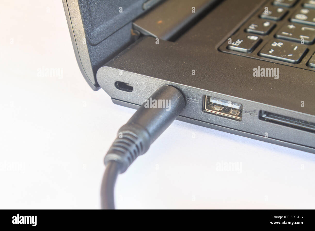 battery charge on laptop computer with power plug Stock Photo - Alamy