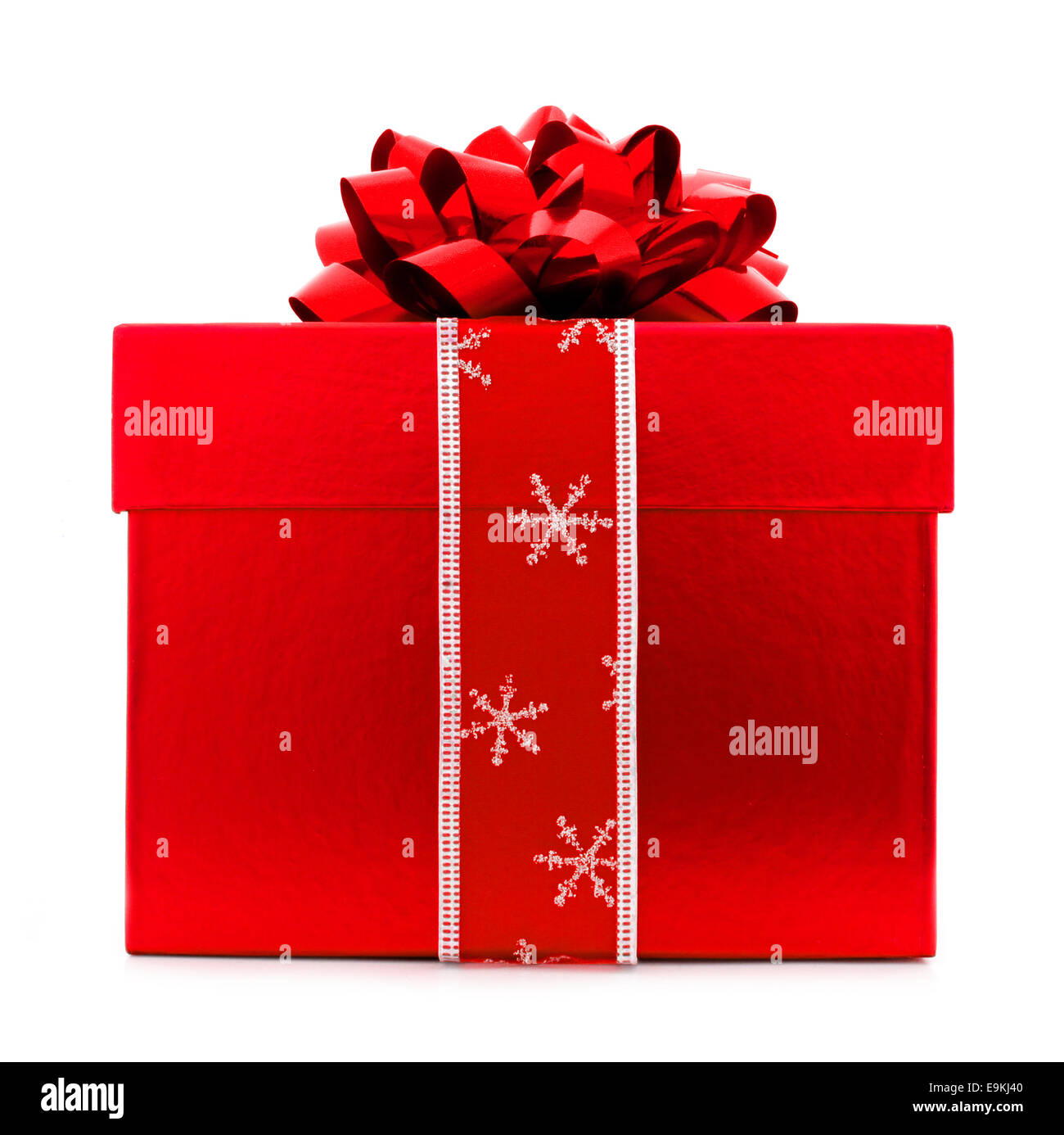 Red Christmas gift box with blue bow and ribbon isolated on white Stock Photo