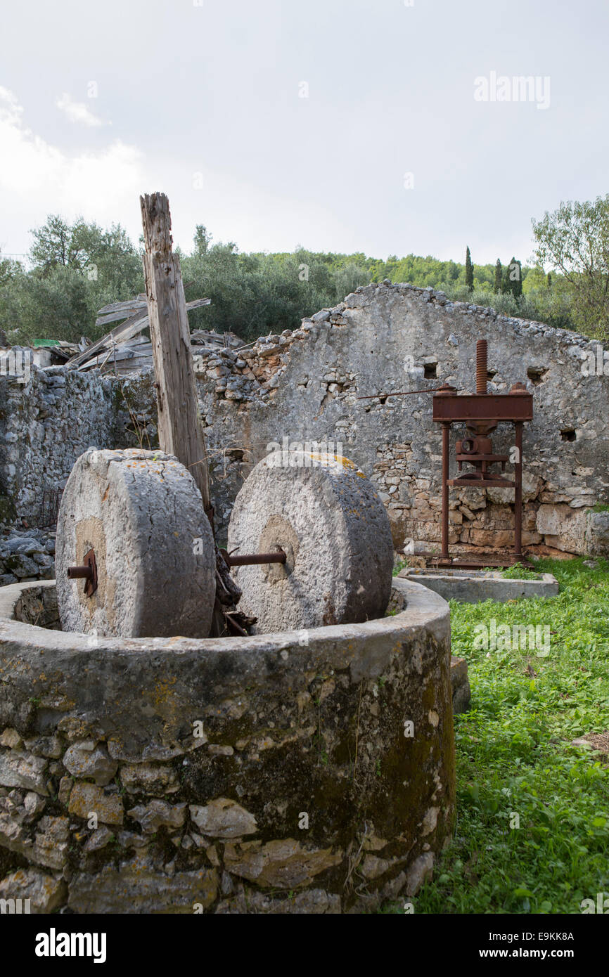Traditional olive presses in the remains of a house at Zakynthos, Greece  (collapsed because of an eathquake) Stock Photo