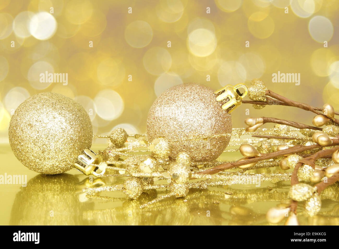 Gold Christmas scene with baubles and defocused light background Stock Photo