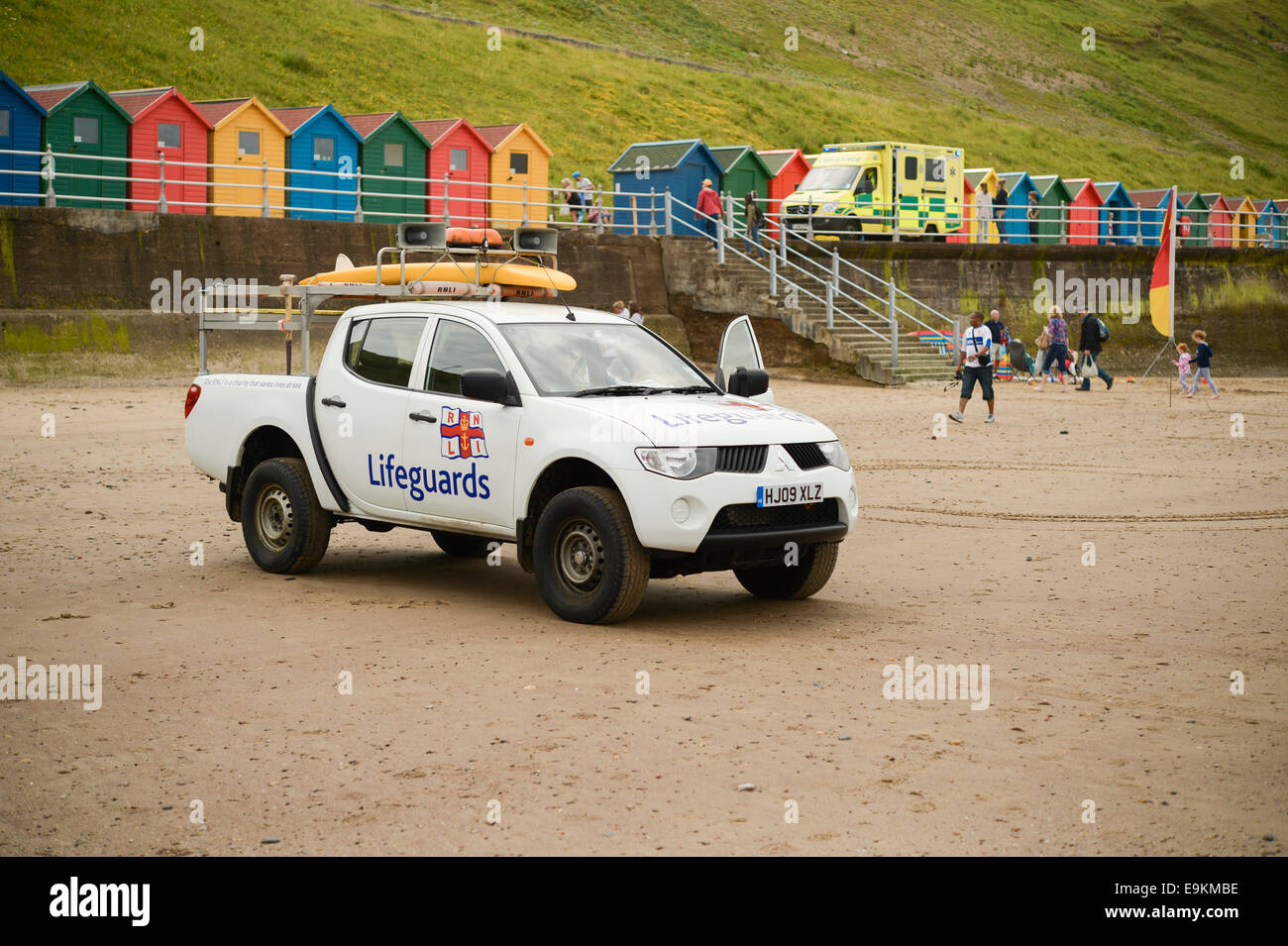 RNLI pickup truck patrol on Whitby beach, N Yorks, UK. A lifeguard is in the driving seat. Stock Photo