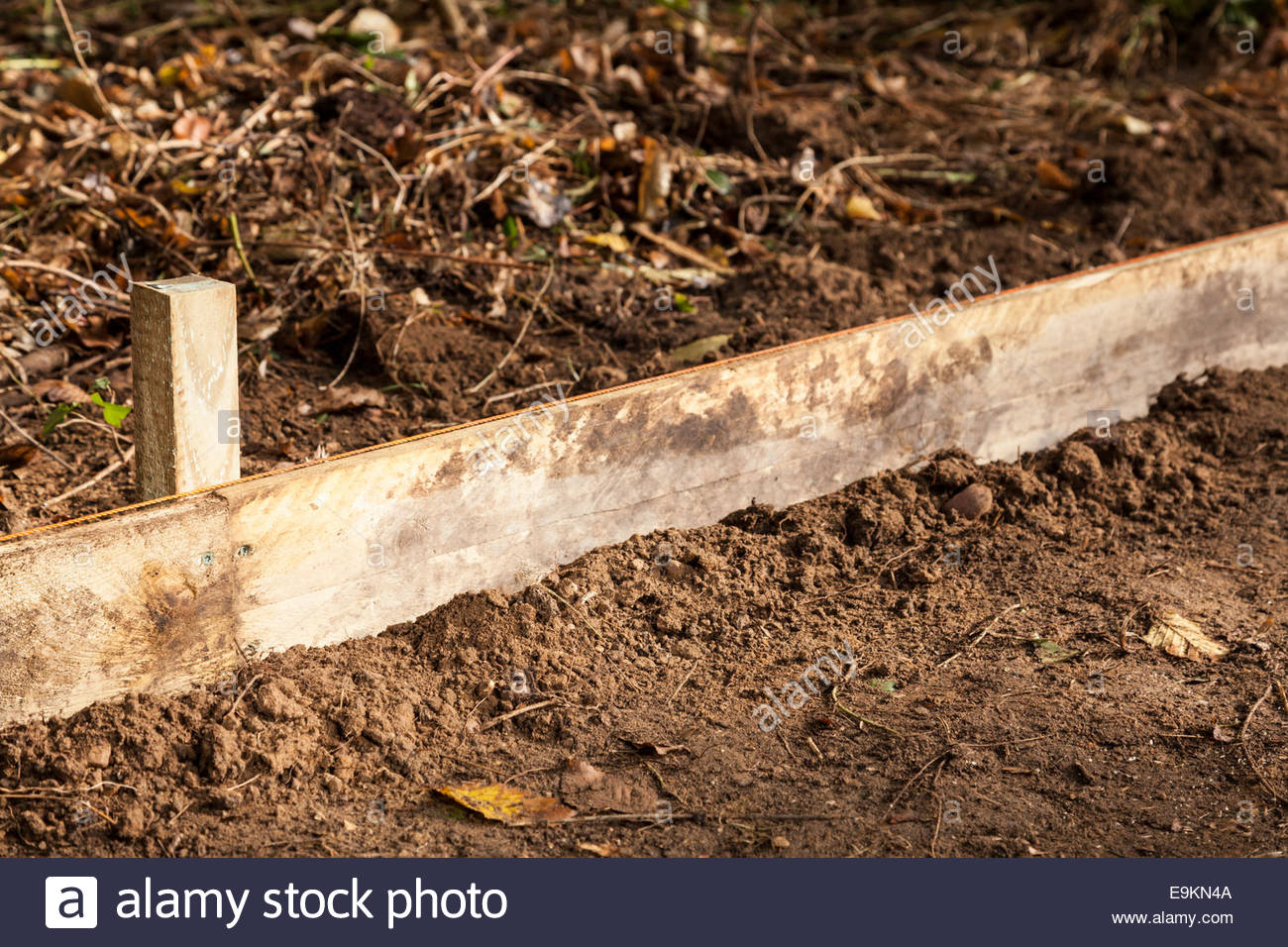 Gravel board or retaining structure in garden Stock Photo 74807050 Alamy