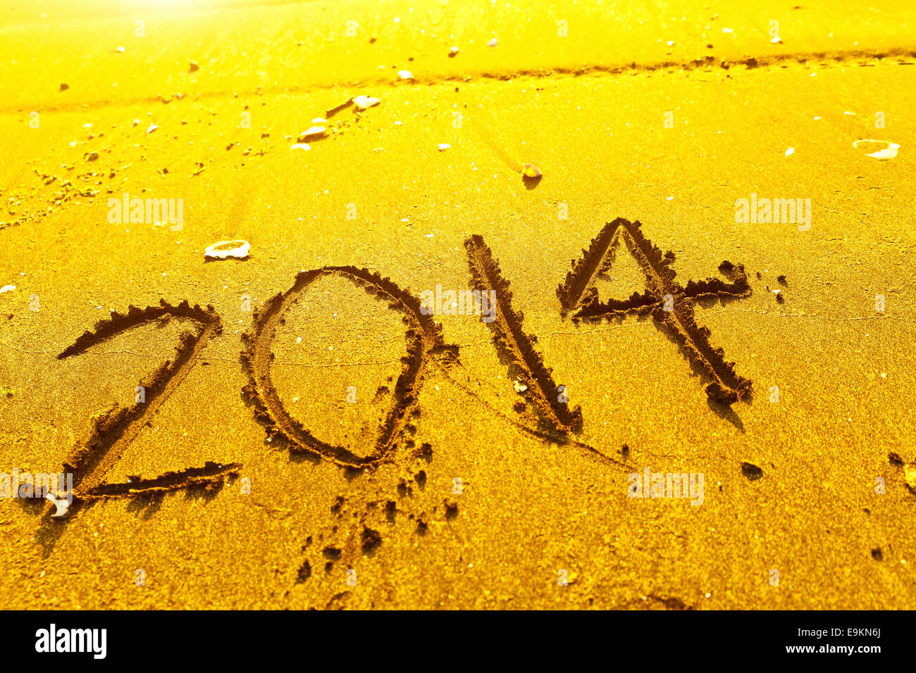 2014 words on sand Stock Photo - Alamy