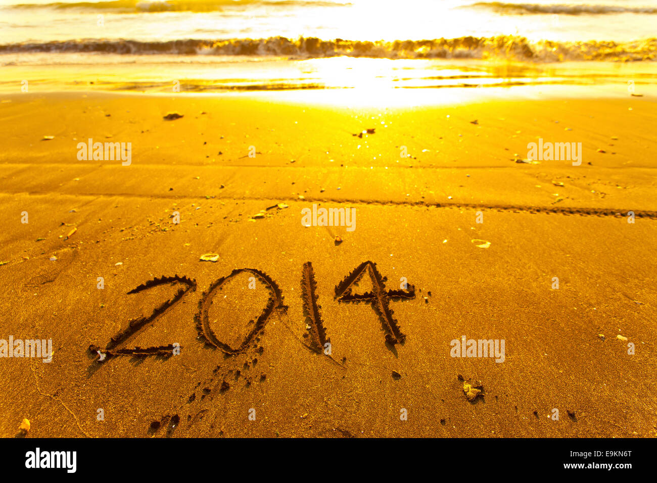 2014 words on sand Stock Photo - Alamy