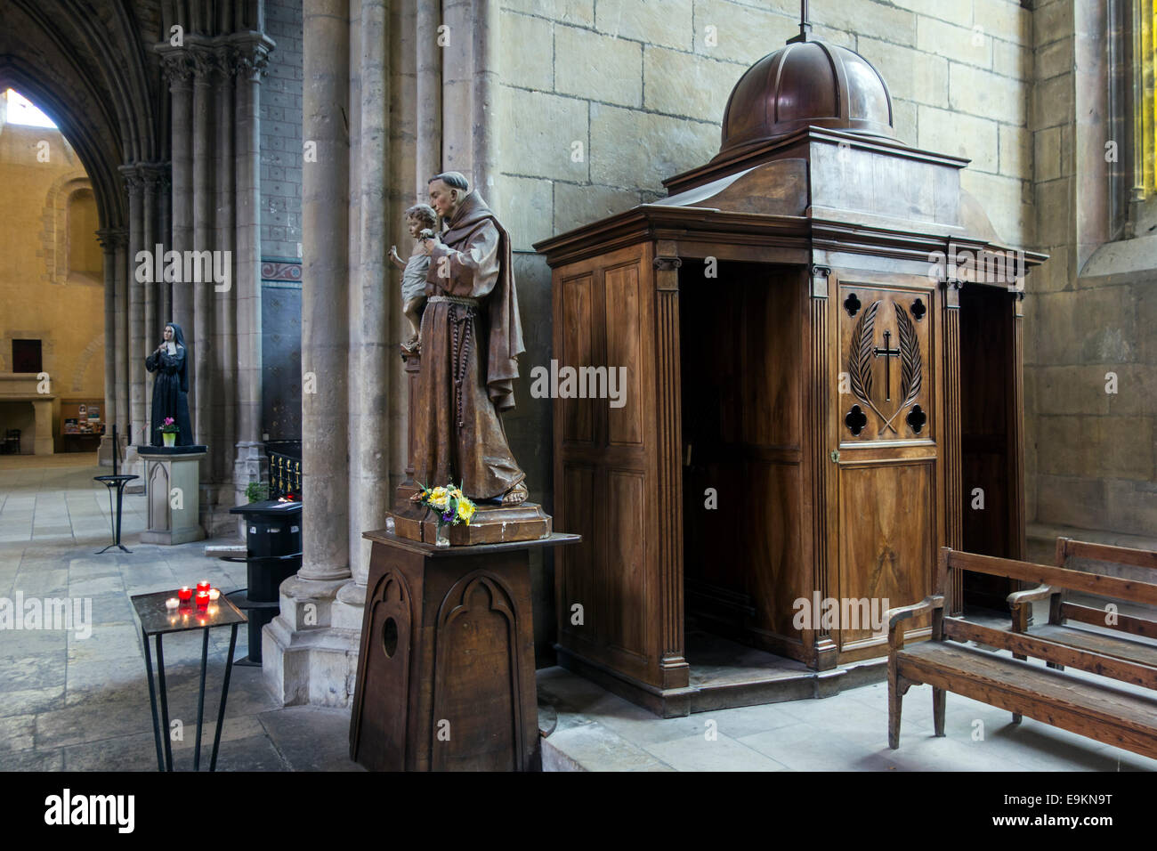 Old wooden sculptures and confessional box in the Nevers Cathedral / Cathédrale Saint-Cyr-et-Sainte-Julitte de Nevers, France Stock Photo