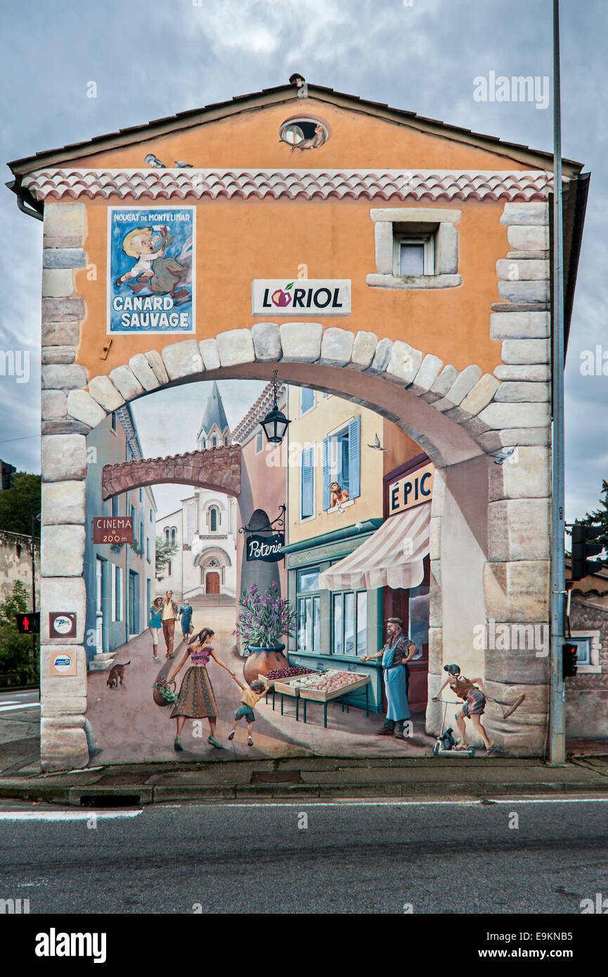 Advertisement for nougat Canard Sauvage and trompe-l'oeil mural along the Route Nationale 7 / RN7 at Loriol-sur-Drôme, France Stock Photo