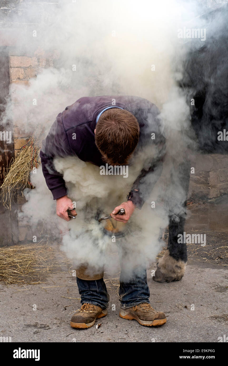 Peebles, UK. 29 Oct 2014. Farrier Hot Shoeing Farrier Ross Philip from
