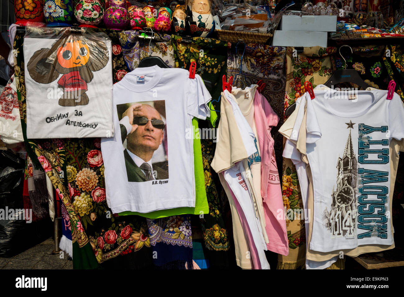 Russian souvenirs waiting for tourists in Red Square in Moscow including very popular t-shirts with picture of Russian President Stock Photo