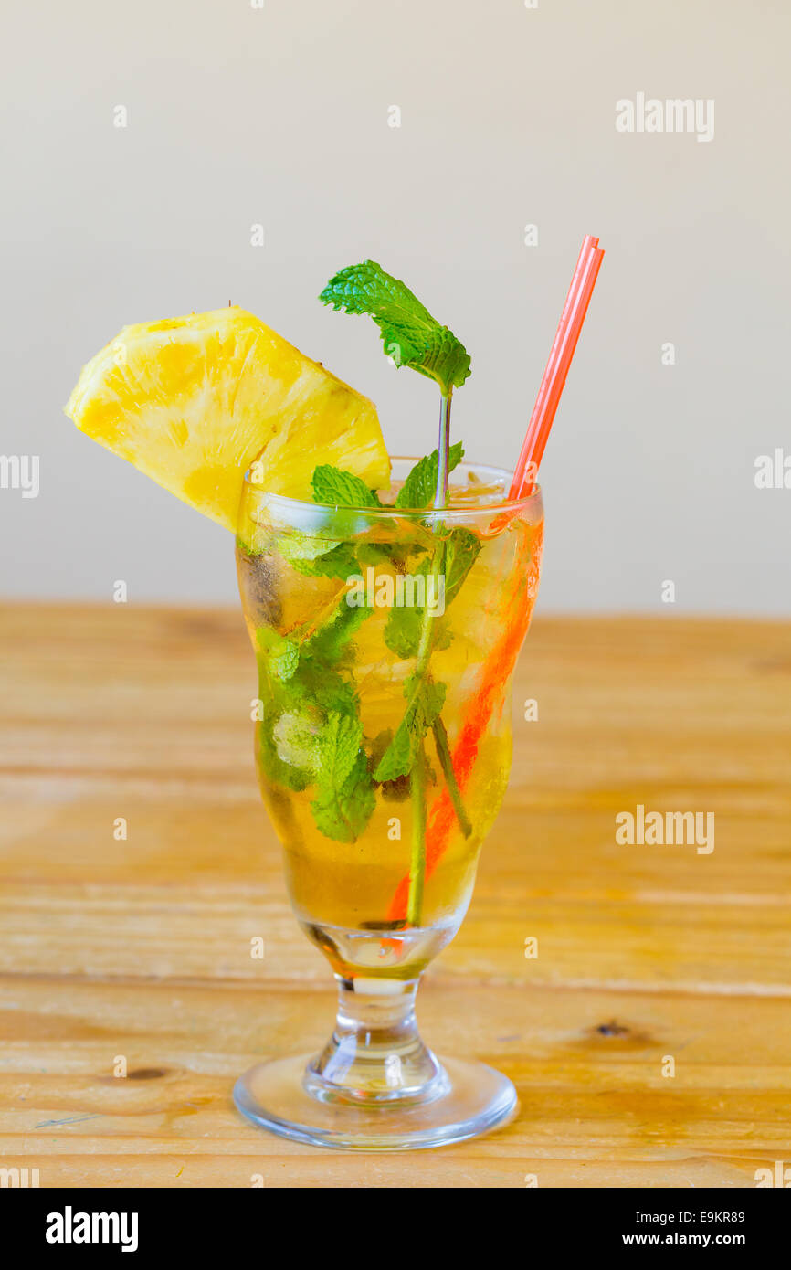Mojito with mint in a traditional mixed drink glass served with a straw at a Mexican restaurant bar. Stock Photo