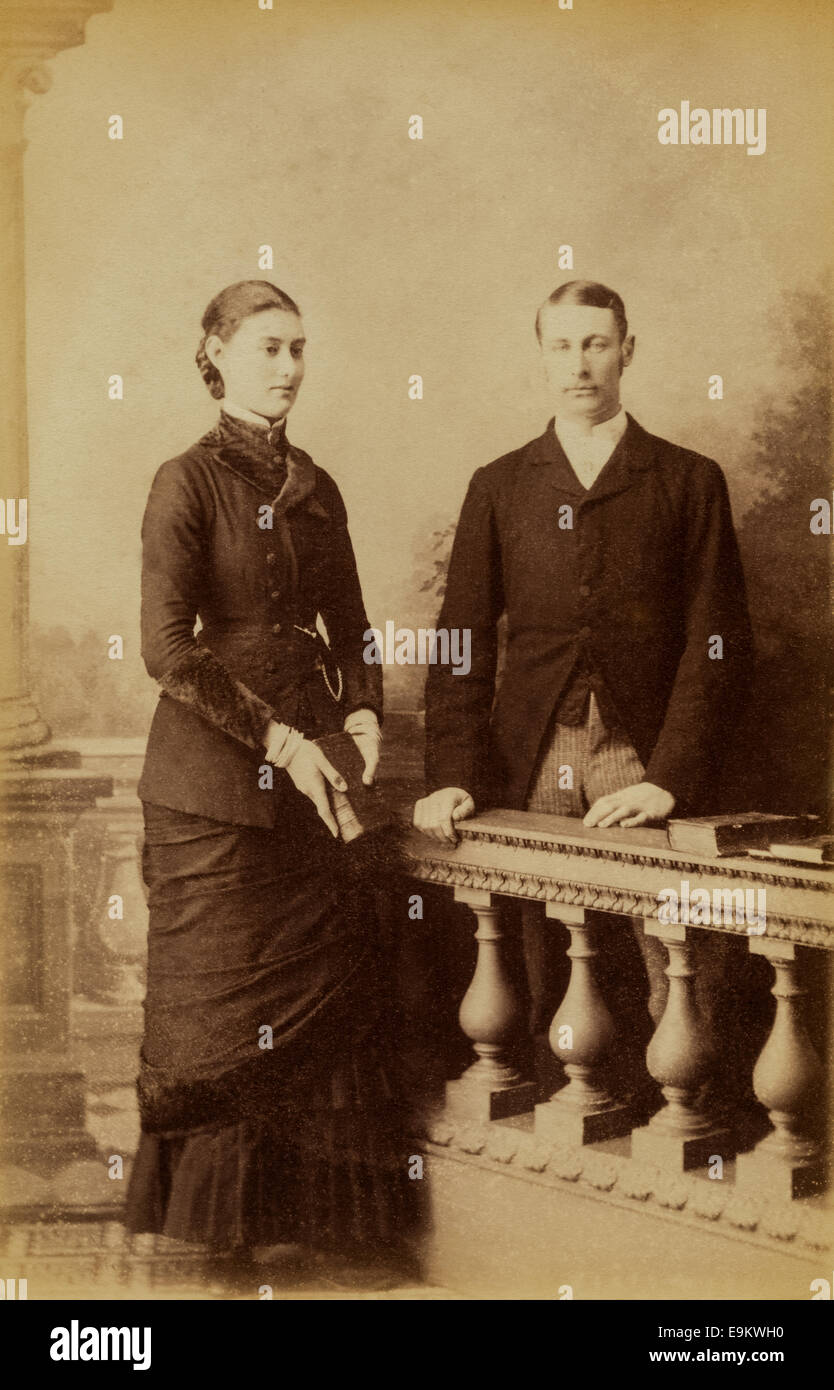 Victorian Cabinet Card studio portrait of a young couple by Charles Smith Allen photographic studio, Tenby, Wales. Circa 1885 Stock Photo
