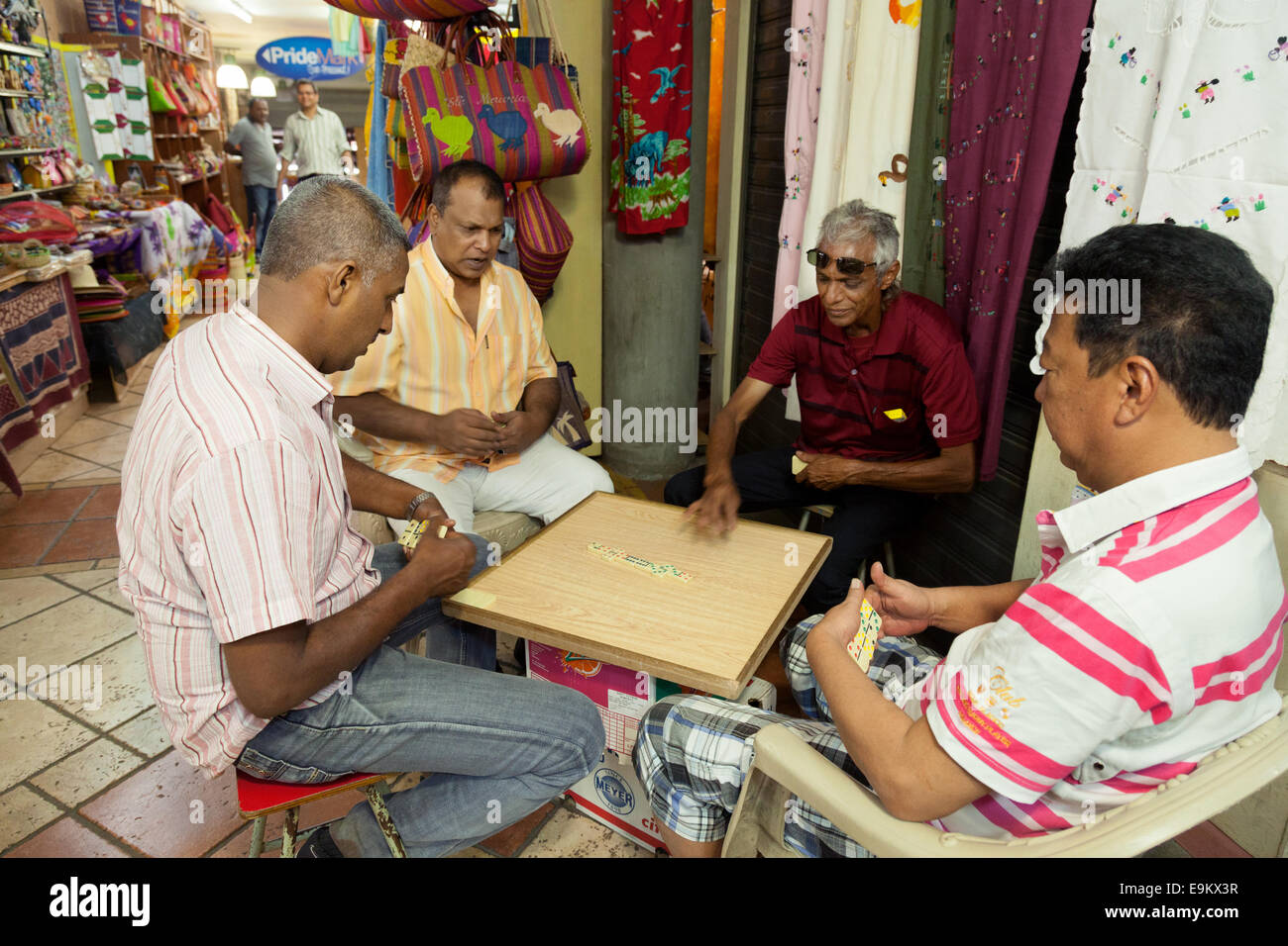 Local Mauritian men playing dominoes, the indoor market, Port Louis, Mauritius Stock Photo