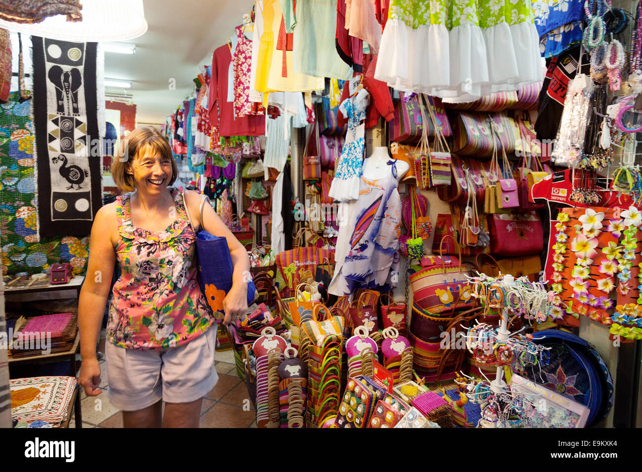 A woman tourist shopping in the indoor clothing market, Port Louis, Mauritius Stock Photo