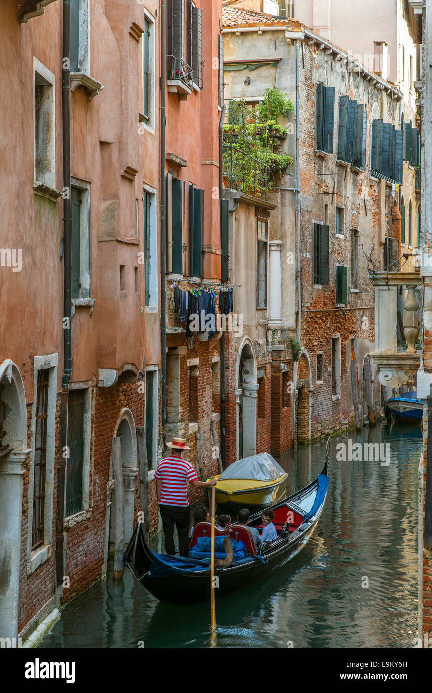 Gondola passing through narrow canal hi-res stock photography and ...